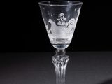 a wine glass that is sitting on a table
