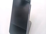 a cell phone that is sitting on top of a stand