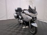 a motorcycle that is parked on a black and white checkered floor