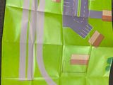a green piece of paper with a picture of a street