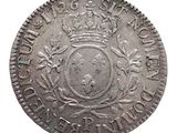 une pièce d'argent surmontée d'une couronne