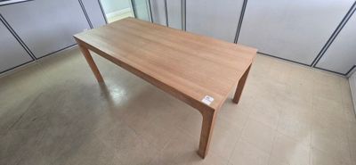 a wooden table in the middle of a room