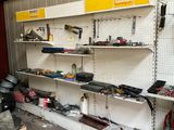 many tools on the shelves in the garage