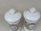 two salt and pepper shakers sitting on a table