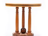 a wooden table with a ball on top of it