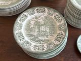 a lot of plates that are sitting on a table