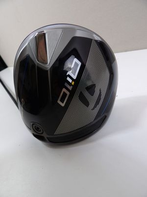 a close up of a golf driver ' s helmet on a table