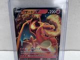 a close up of a pokemon card in a plastic case