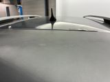 a close up view of a car ' s hood and roof