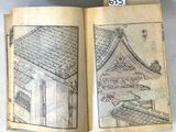 an open book with a drawing of a building on it
