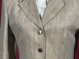an image of a woman ' s jacket and tie on a mannequin dummy