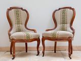 pair of antique chairs with upholstered upholstered back and arms