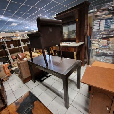 a chair that is sitting on a table in a room
