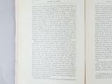 an open book on a table with a white background