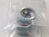 two silver and blue cupcakes in a plastic bag