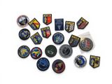 a lot of patches that are on a white surface