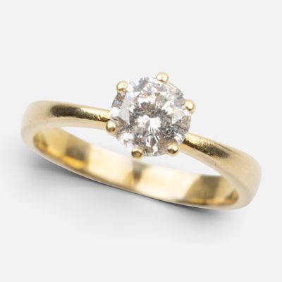 a close up of a diamond ring on a white background