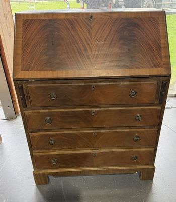 an old wooden desk with drawers and drawers on it