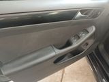 the door handle of a car is open to show the interior