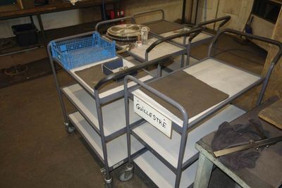 a cart that has a lot of items on it