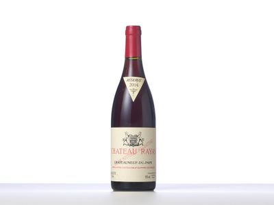 the bottle of red wine is sitting on the table