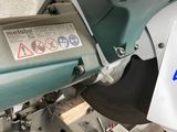 a sign on the side of a machine that has a sticker attached to it