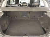 a trunk of a car with the back seats folded down