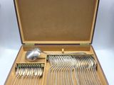 a wooden box with silverware in it on a table