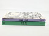 two books are stacked on top of each other on a white surface