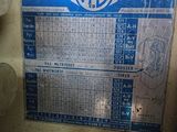 a blue and white sign on the side of a wall