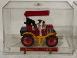 a small toy truck in a clear box