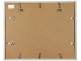 a close up of a piece of cardboard with clips attached to it
