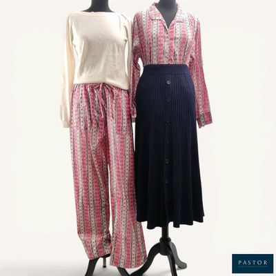 pair of women ' s clothing displayed on mannequins on a white background