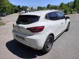 the rear end of a white car parked in a parking lot