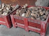 two crates of wood sitting next to each other on the ground