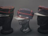 three hats are lined up on top of a mannequin head
