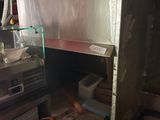 a small kitchen with a stove and a microwave in it