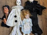 several dolls are lined up on a wooden floor next to each other