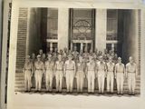 an old photo of a group of men in uniform