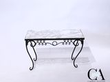 an image of a table with a marble top and wrought legs