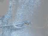 a silver purse that is sitting on a table