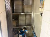 a small kitchen with many dishes on the shelves