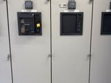 three metal lockers with different types of electrical equipment