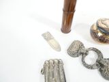 a lot of silver items on a white table