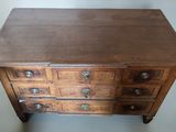 an old wooden chest of drawers with drawers and drawers on top