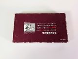 a red business card sitting on top of a white table