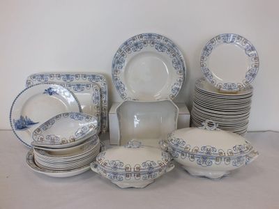 a lot of plates and bowls sitting on a table