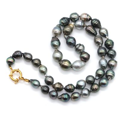 the necklace is made of black pearls and gold