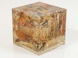 a small wooden box with a painting on it