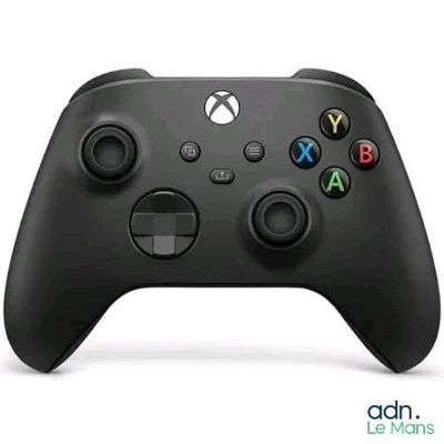 a close up of a black xbox controller on a white surface
